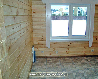 Log home kits and packages made from laminated squared logs