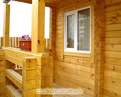 Cottage constructed from laminated squared logs